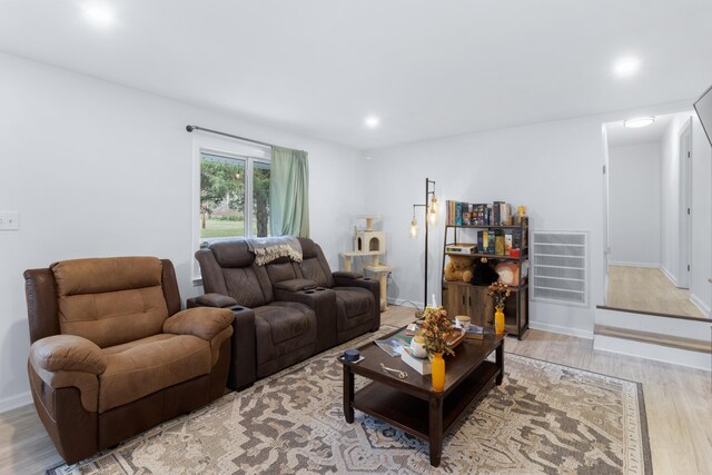 living room with light hardwood / wood-style floors