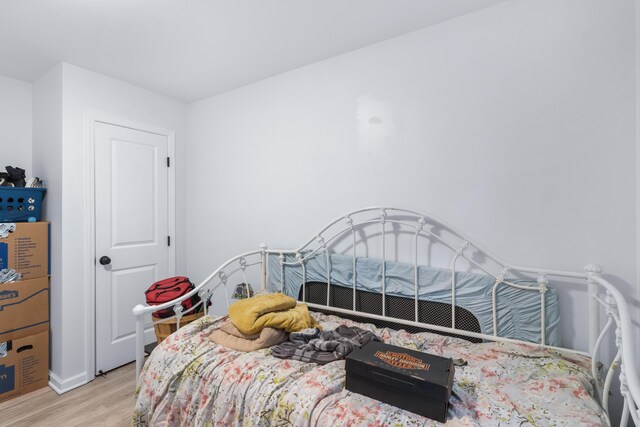 bedroom with light wood-type flooring