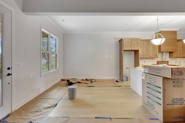 kitchen with pendant lighting, sink, light hardwood / wood-style flooring, light brown cabinetry, and crown molding