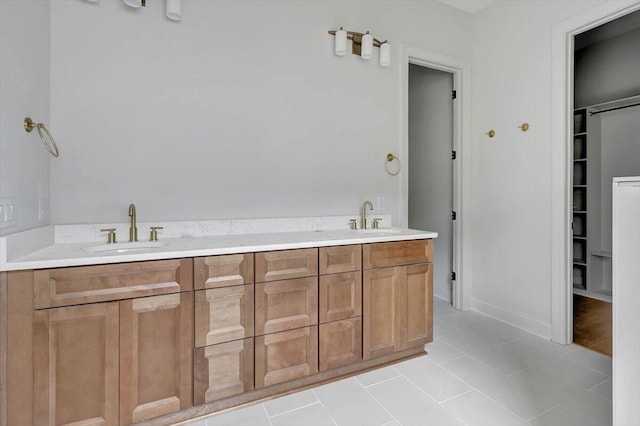 bathroom with vanity and tile patterned flooring