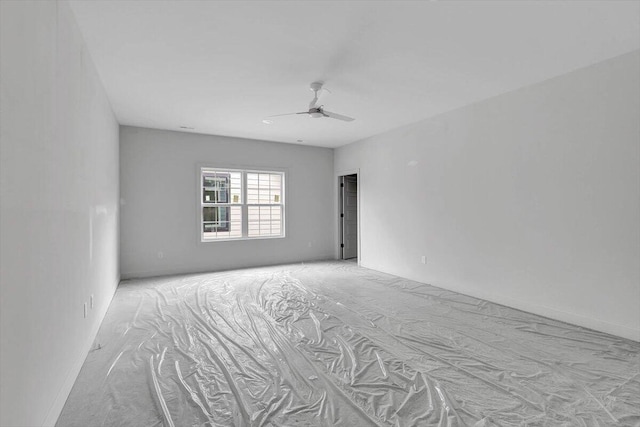 unfurnished room featuring light carpet and ceiling fan