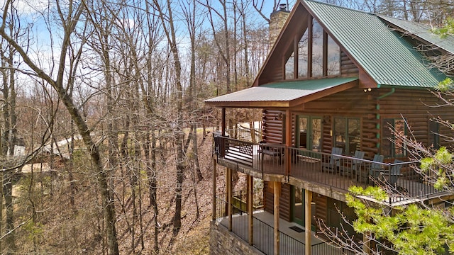 view of property exterior featuring a deck