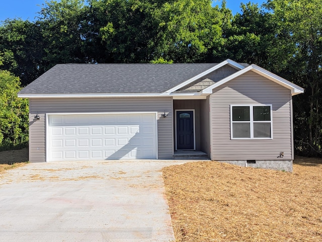 ranch-style house featuring a garage