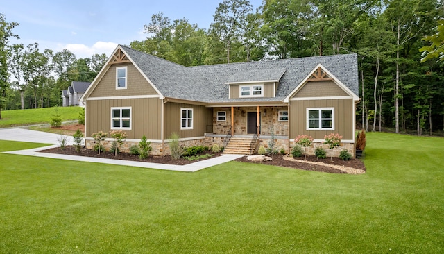 craftsman-style home featuring a porch and a front lawn