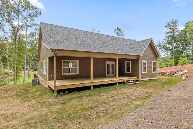 back of house with a yard and french doors