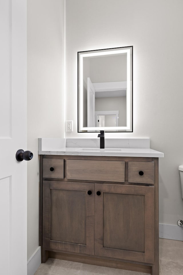 bathroom with vanity and toilet