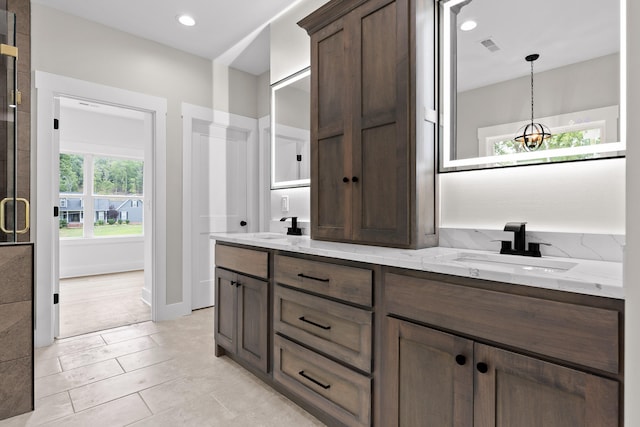 bathroom featuring tile patterned flooring and vanity