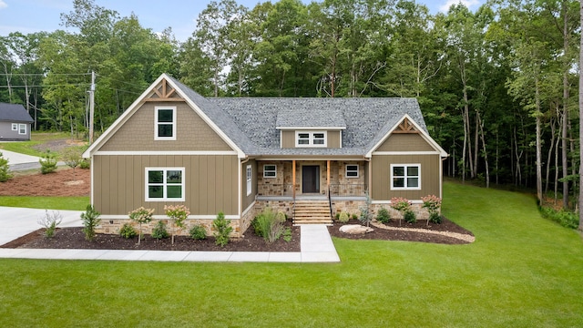 craftsman-style house with covered porch and a front yard