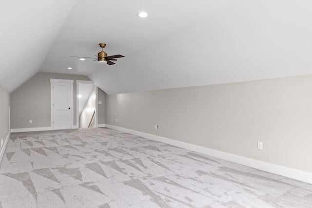 bonus room with ceiling fan, light colored carpet, and vaulted ceiling