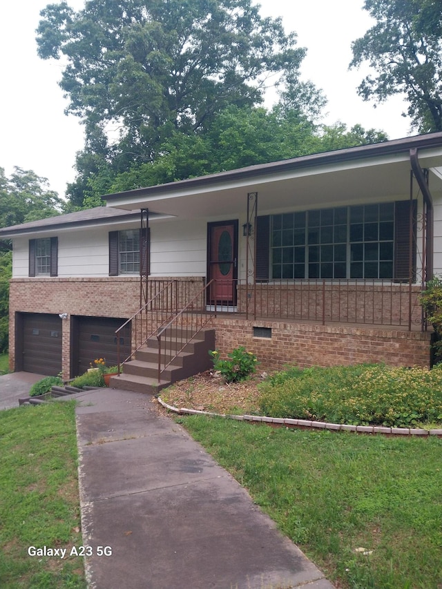 view of front of property with a garage and a front lawn