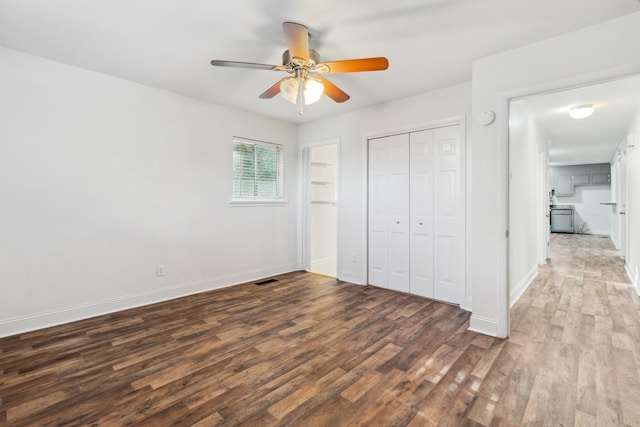 unfurnished bedroom featuring dark hardwood / wood-style flooring and ceiling fan