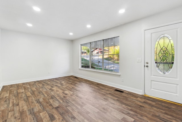 entryway with dark wood-type flooring