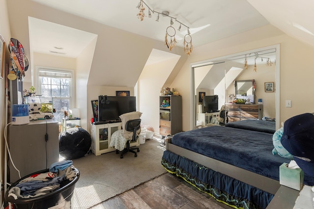 bedroom featuring a closet and lofted ceiling