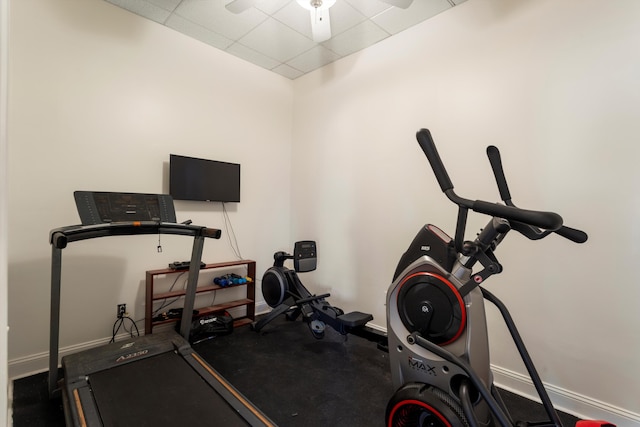 workout room with a paneled ceiling