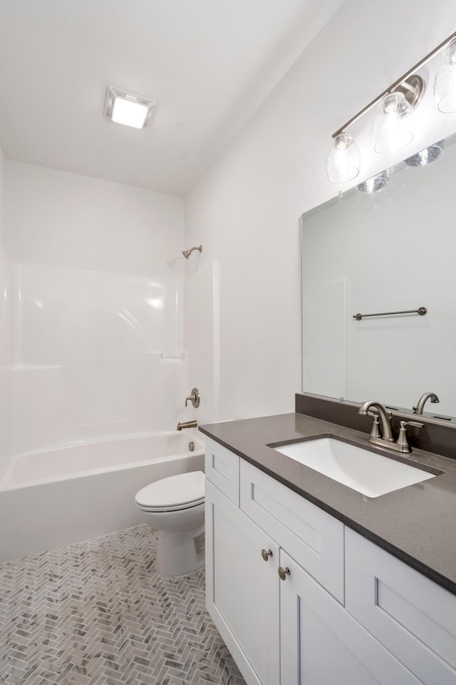 full bathroom featuring shower / bath combination, vanity, and toilet