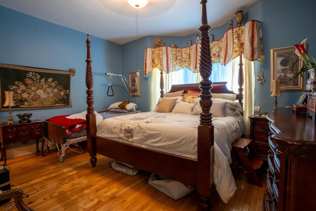 bedroom with hardwood / wood-style flooring