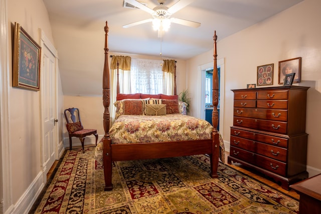 bedroom with baseboards, visible vents, and a ceiling fan
