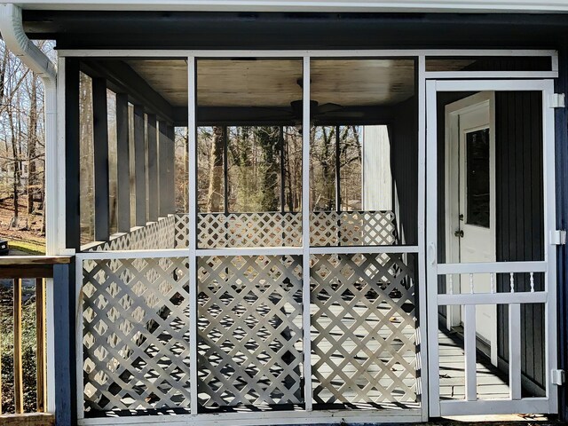 wooden deck featuring a sunroom