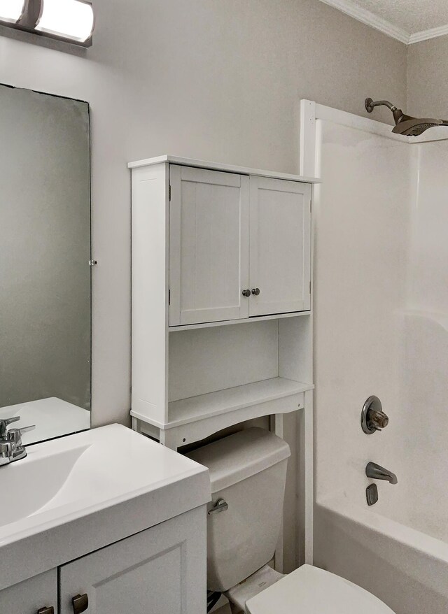 full bathroom featuring shower / bath combination, toilet, crown molding, and vanity