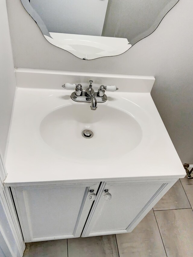 room details with vanity and tile patterned floors