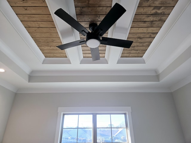 room details featuring a raised ceiling, wooden ceiling, and crown molding