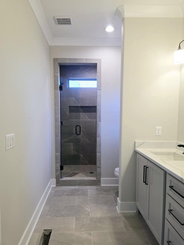 bathroom featuring crown molding, toilet, vanity, and walk in shower