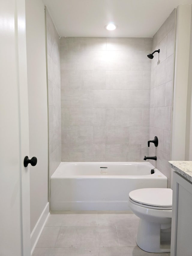 full bathroom with tile patterned flooring, vanity, toilet, and tiled shower / bath