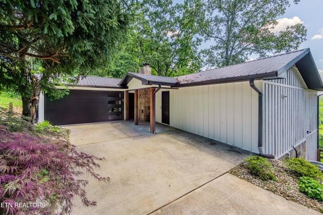 view of side of home featuring a garage