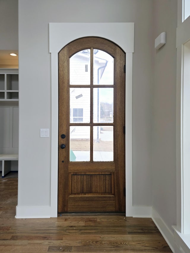 foyer with dark hardwood / wood-style floors