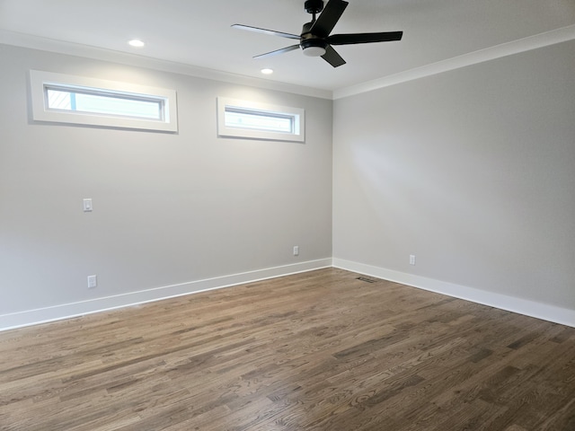 spare room featuring wood-type flooring, ceiling fan, and crown molding