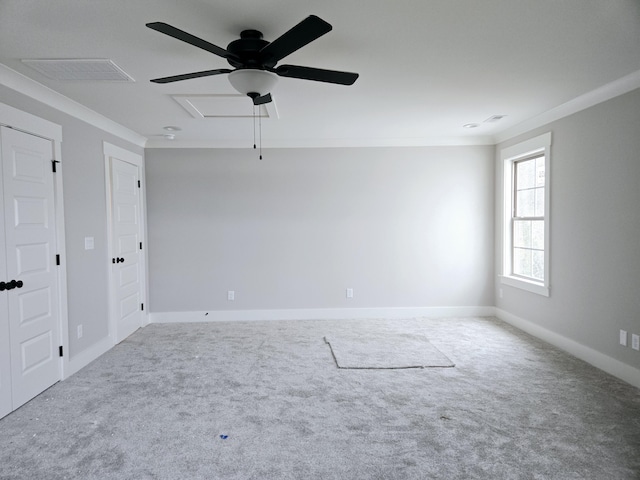 unfurnished room with ceiling fan, carpet floors, and ornamental molding