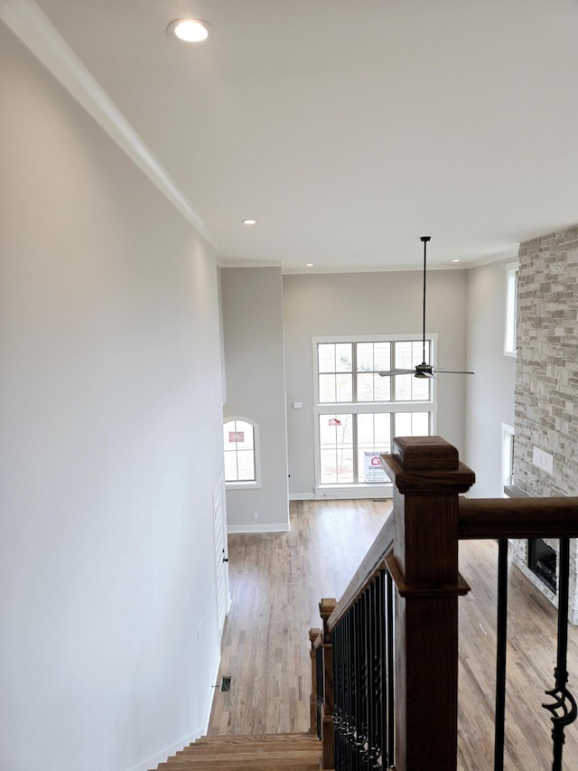 corridor with light hardwood / wood-style floors