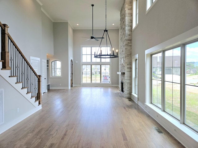 3297 Grassland Cir Unit 7, Apison, TN 37302 - unfurnished living room with ceiling fan, visible vents, baseboards, light wood finished floors, and a high ceiling