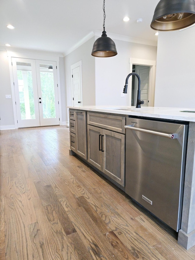 3297 Grassland Cir Unit 7, Apison, TN 37302 - kitchen featuring french doors, pendant lighting, wood finished floors, dishwasher, and a sink