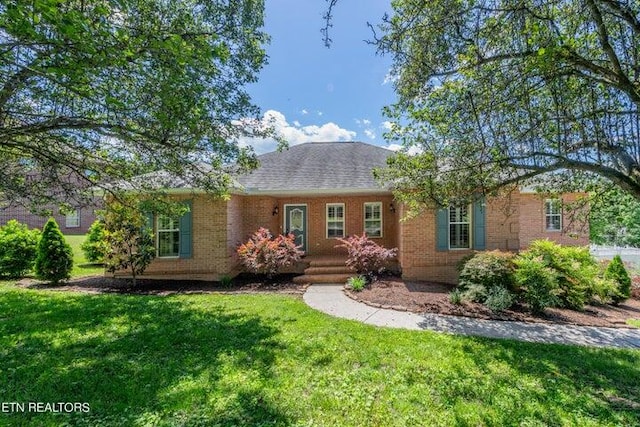 single story home with a front yard