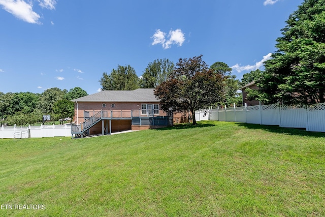 view of yard with a deck