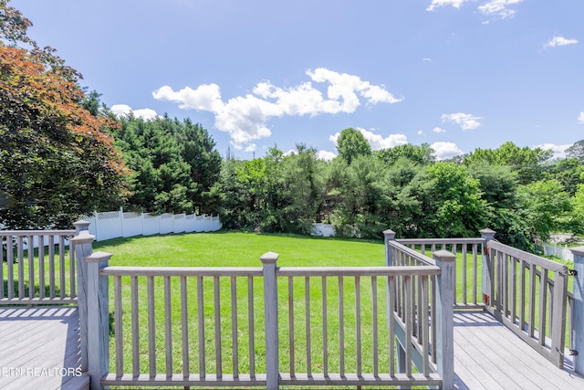 deck featuring a lawn