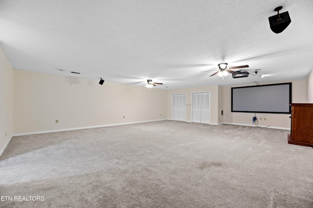 carpeted cinema with a textured ceiling