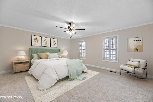 bedroom with light carpet, a textured ceiling, ceiling fan, and crown molding