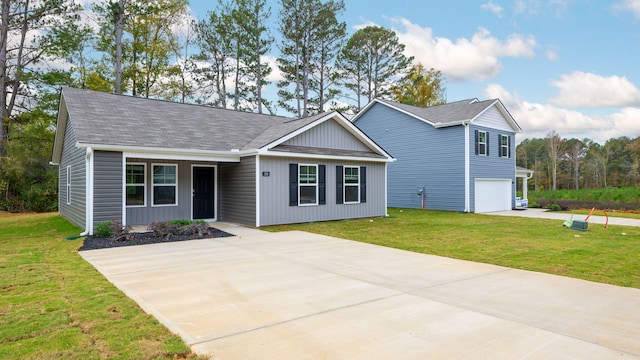 view of front facade with a garage and a front lawn