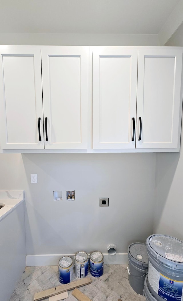 laundry area with cabinets, hookup for a washing machine, and electric dryer hookup