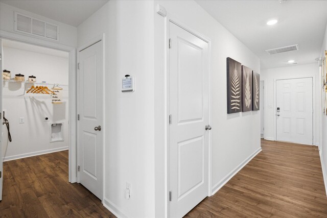 hall with dark hardwood / wood-style floors