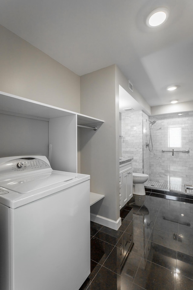 laundry area featuring visible vents, granite finish floor, baseboards, washer / dryer, and laundry area