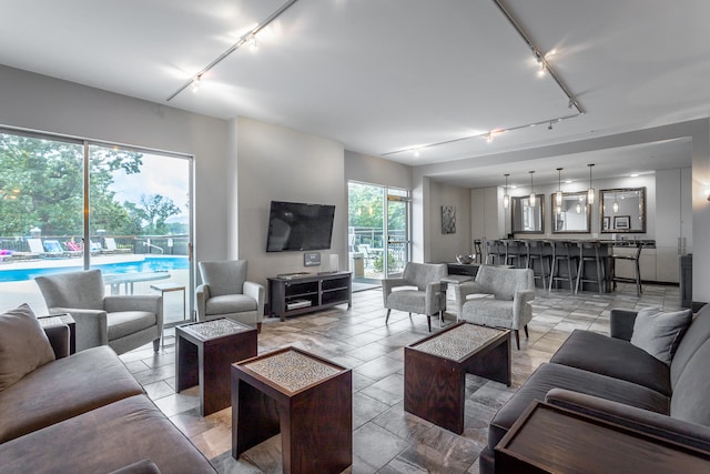 living room featuring rail lighting