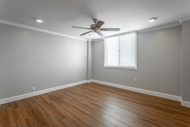 empty room with wood finished floors, baseboards, ceiling fan, and ornamental molding