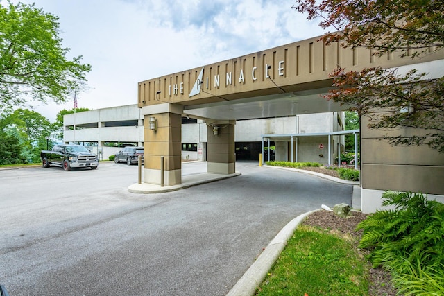 view of property featuring uncovered parking