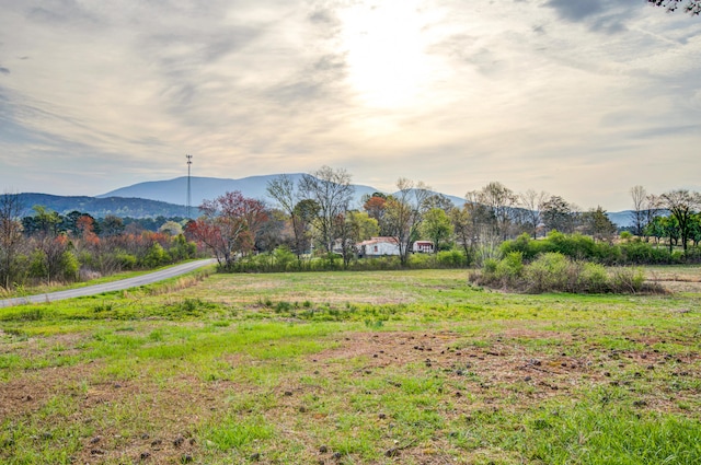 mountain view featuring a rural view