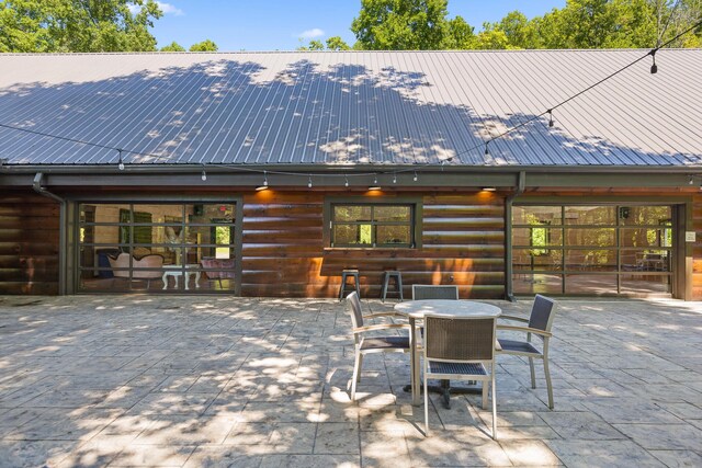 back of property featuring french doors and a patio