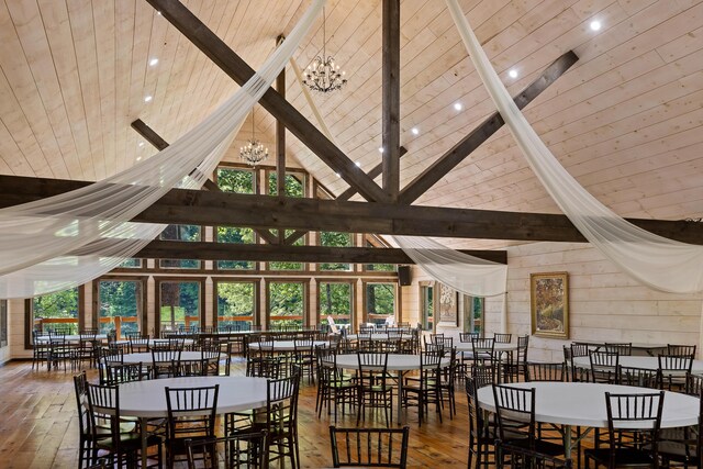 dining room featuring hardwood / wood-style flooring, plenty of natural light, and an inviting chandelier