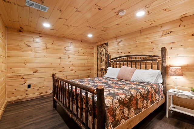 bedroom with wood walls, hardwood / wood-style floors, and wooden ceiling